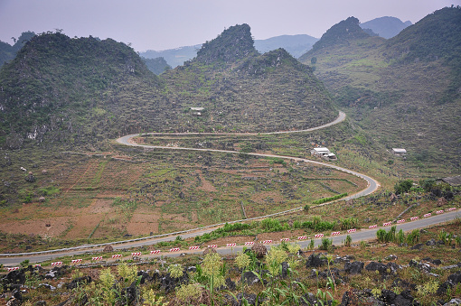 Mountain road at Meo Vac Township in Ha Giang province, Vietnam. Ha Giang is a highly mountainous region, and travel around the province can be difficult.