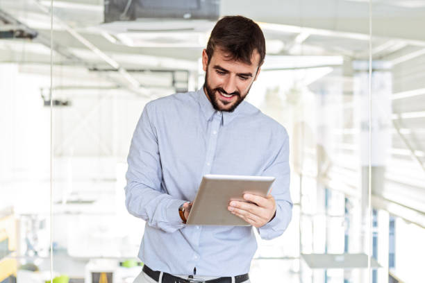 istock Smiling businesswoman using his digital tablet in the office 1751646276