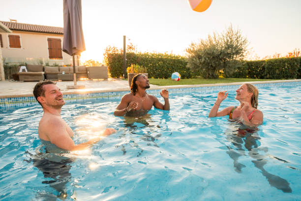 istock Splashy Ball Game at the Diverse Pool Party 1751653288