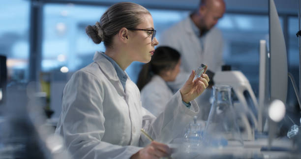 istock Science, study and sample with a woman in a laboratory as a doctor to research a cure through innovation. Medical, pharmaceuticals or solution with a young scientist working in a lab for breakthrough 1751660863