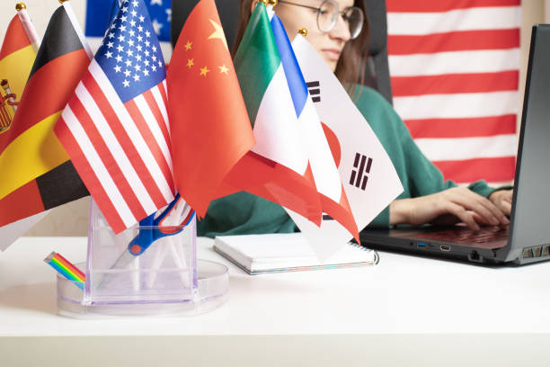 istock Teenager learning languages, international eLearning, student at a table with a laptop, foreign studies 1751666938
