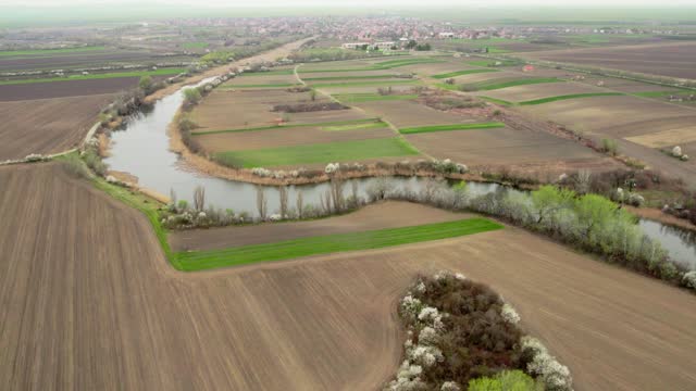 Drone Shot of River Meandering Through Fields