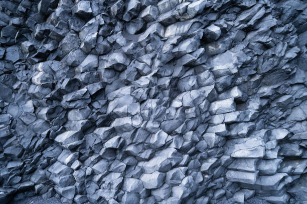 istock Basalt stones as a background. Image for background and wallpaper. Sharp rocks. Photography for design. Textures in nature. 1751671423