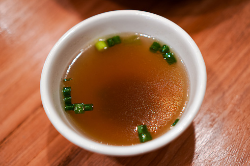 Close-up image of ready-to-drink hot soup placed on the dining table.