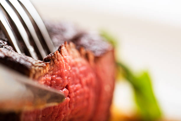 istock Slicing into juicy fillet steak grilled medium rare, delicious! 175168949