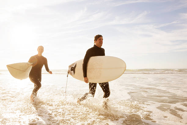 istock Surfers running in the ocean 175169460