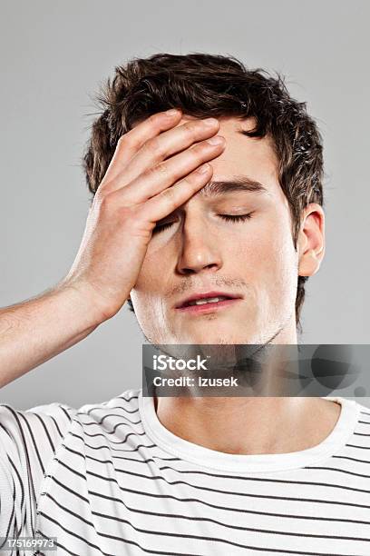 Headache Stock Photo - Download Image Now - Men, Sadness, 20-24 Years