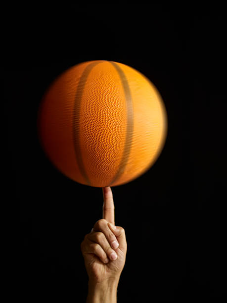 istock Man Spinning Basketball In Air 175170293