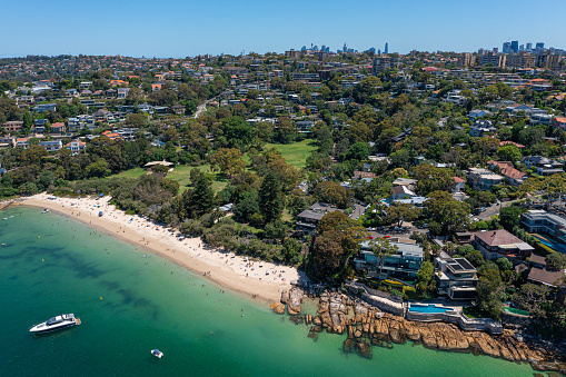 Panoramic drone aerial view over Cobblers Bay and Chinamans Beach in Mosman, Northern Beaches area of Sydney, Australia.