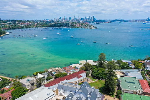 Drone aerial view of Rose Bay, eastern suburb of Sydney with Harbour Bridge and Opera House in the distance