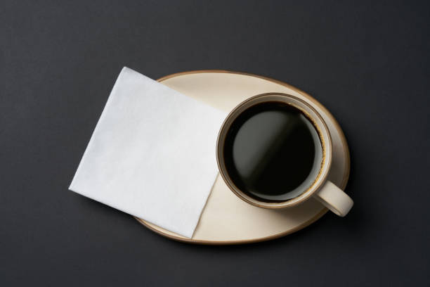 istock Black coffee and coffee beans on black background 1751709581