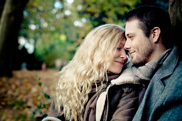 istock young amorous couple portrait on nature background 175171136