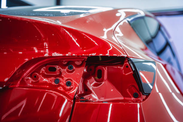 istock The process of installing protective film on the new red car. 1751712348