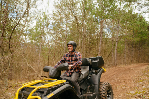 istock Senior man riding a quad bike 1751716256
