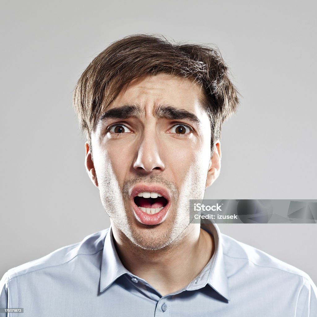 Bad news Portrait of scared businessman reacting on bad news, looking at the camera. 25-29 Years Stock Photo