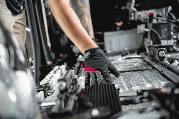 istock Tunning service worker install soundproofing material inside car interior 1751721962