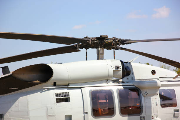 istock close up helicopter rotor blade  parking on run way against blue sky 1751724157