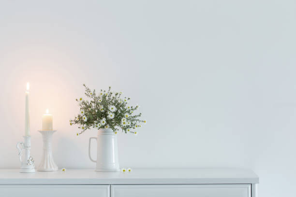istock white flowers in white ceramic vase in white interior 1751724182