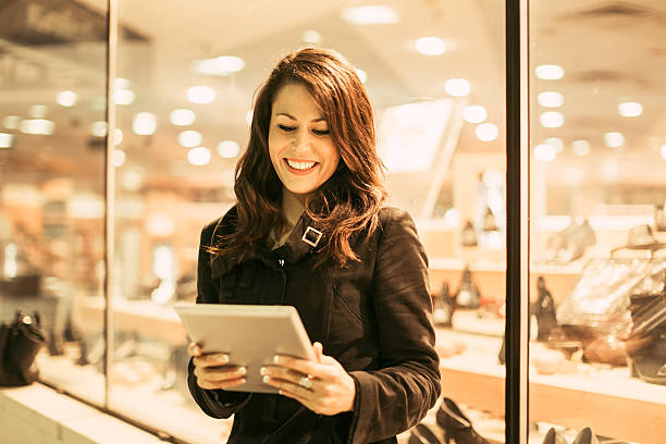 istock Young woman using digital tablet on the street 175172463