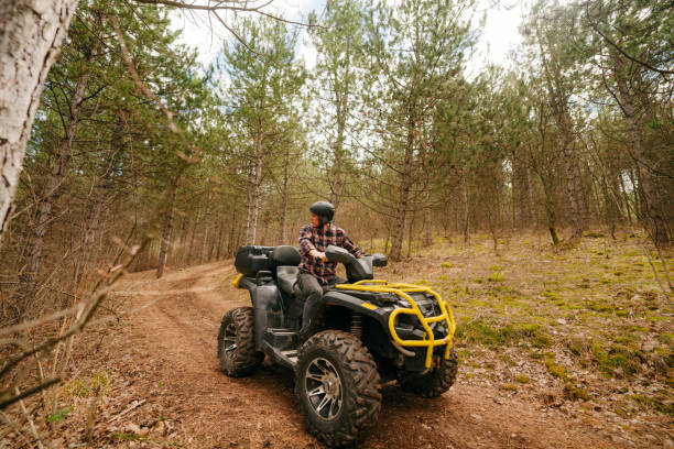 istock Senior man riding a quad bike 1751727035
