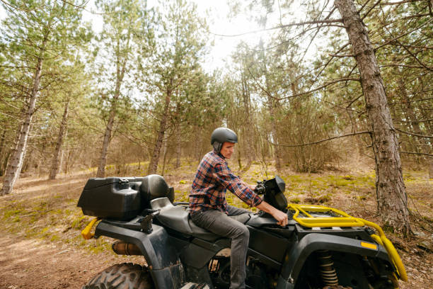 istock Senior man riding a quad bike 1751727036