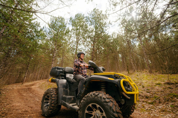 istock Senior man riding a quad bike 1751728675