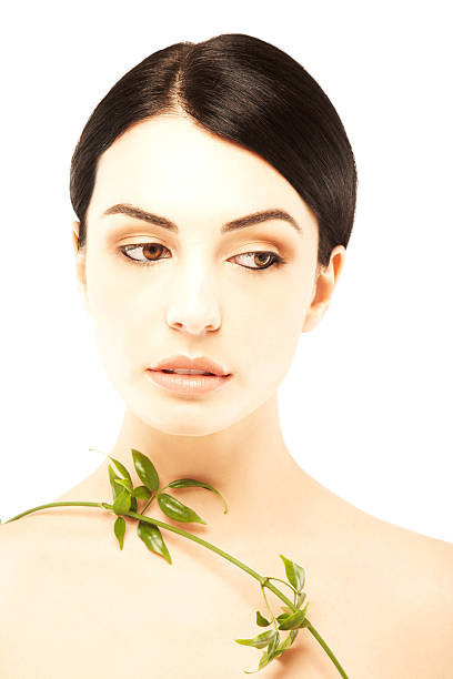 istock Attractive young woman holding olive branch 175173157