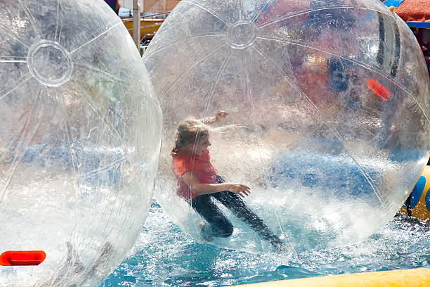 istock Child in Large Ball Carnival Game Amusement Park Ride 175173391