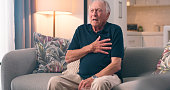 Senior man, stress and heart attack in pain, worry and fear of death, condition and healthcare emergency. Elderly person, anxiety and suffering a cardiac arrest, chest or medical crisis in retirement