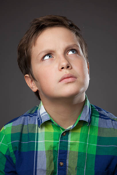 istock Preteen Boy Expressions - Thinking 175174479