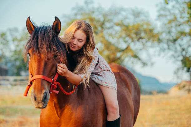 istock Young cute girl hugging her horse 1751748774