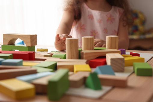 Little girl playing wooden block