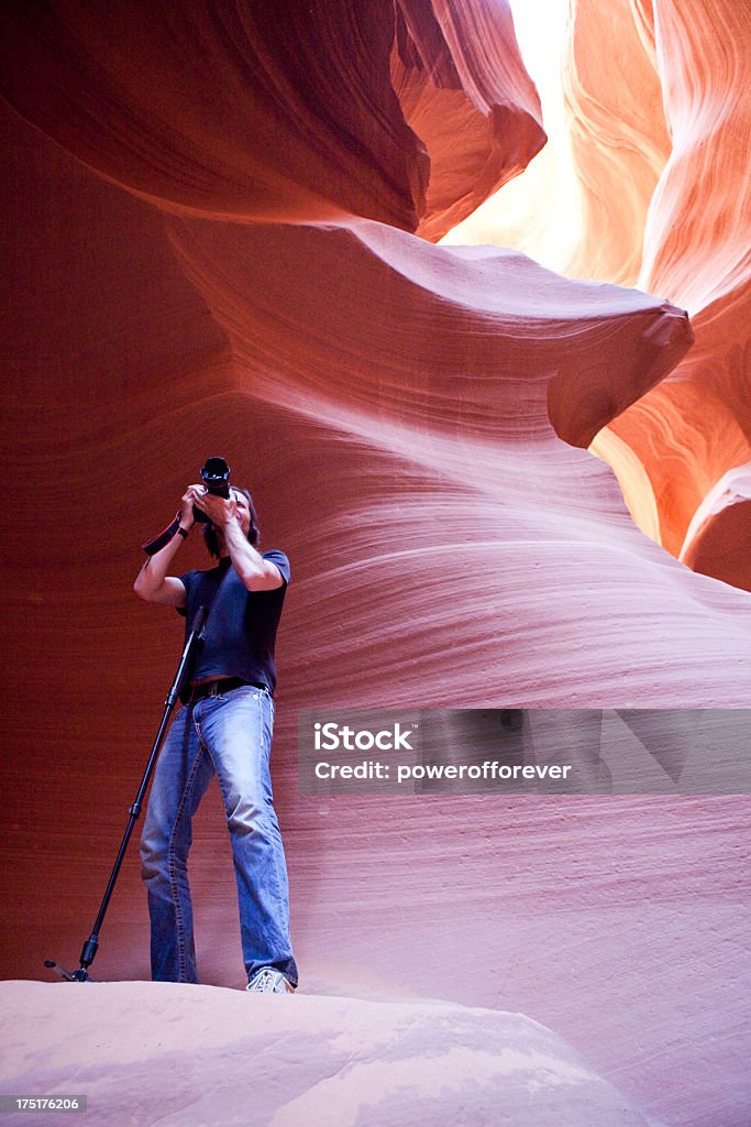 Photographer in Antelope Canyon "Photographer capturing an image at Antelope Canyon in Arizona, USA." Arizona Stock Photo