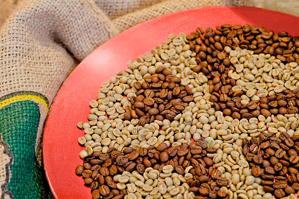 Roasted and natural coffee beans Roasted and natural coffee beans aromatisch stock pictures, royalty-free photos & images