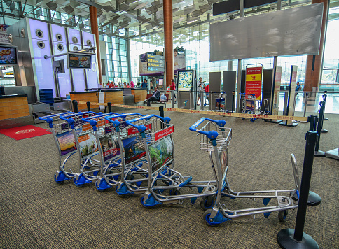 Singapore - Mar 14, 2016. Trolleys at Departure Terminal of Singapore Changi Airport. The Airport serves more than 100 airlines flying to 380 cities in around 90 countries.