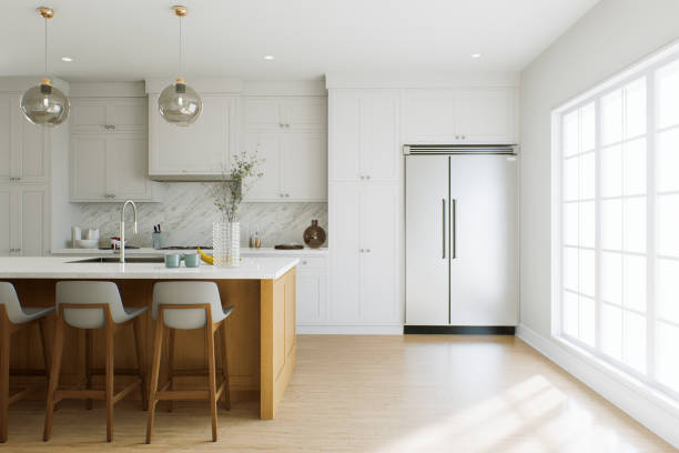 istock Bright kitchen with island and large double door refrigerator. White kitchen interior with household appliances. 3D rendering 1751769858