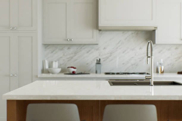 istock View of a kitchen island, white marble countertop with blurred white kitchen background for product presentation. Table with blurred kitchen background in bokeh. 3D rendering 1751770170