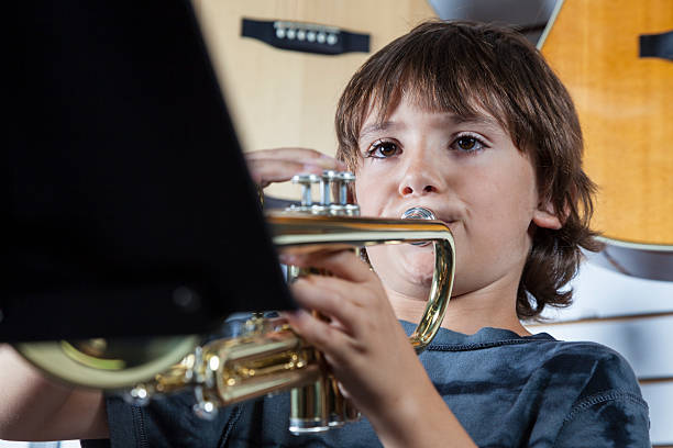 1,300+ Boy Playing Trumpet Stock Photos, Pictures & Royalty-Free Images -  iStock