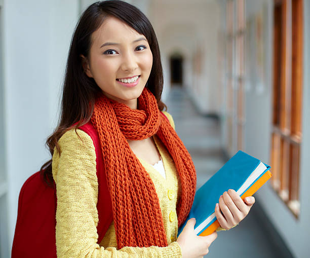 istock portrait of pretty young college student 175177190