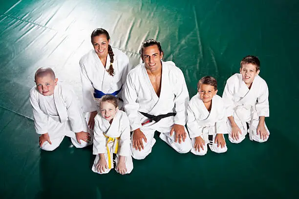 Jiu-Jitsu class - Instructors (20s) with students (5 to 9 years).  Brazilian jiu-jitsu is a martial art, self defense system and combat sport.