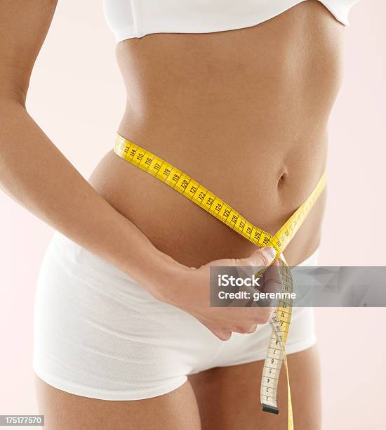 Woman Measuring Hips With Tape Measure Stock Photo - Download Image Now - 20-29 Years, 30-39 Years, Adult