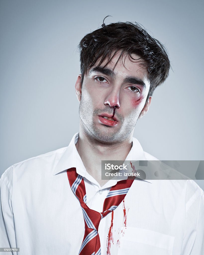 Victim of violence Portrait of injured man dirty by blood looking at the camera. 25-29 Years Stock Photo