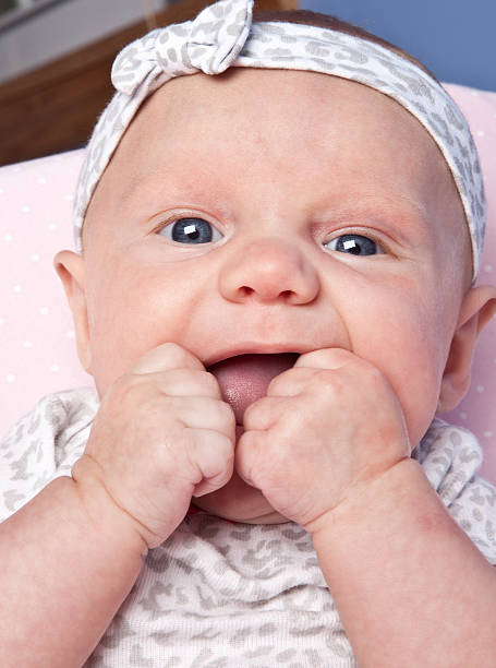 istock Cute Baby Girl Trying To Bite Hands 175178422