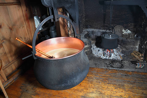 swiss traditional cheesemakers cottage with cauldron and open fire