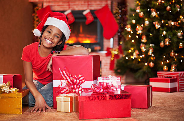 istock Cute girl among Christmas presents 175179359