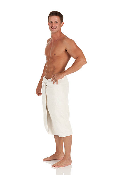 istock Happy attractive young man wrapped in a towel 175179399