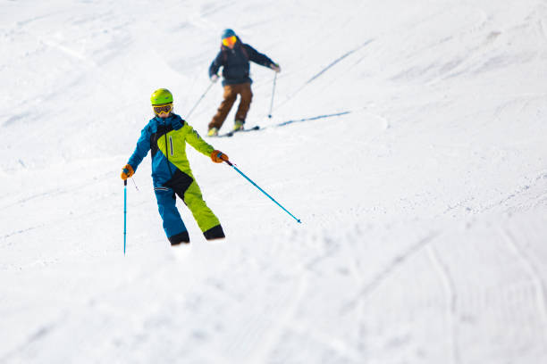 istock Father and son skiing in mountains 1751799090
