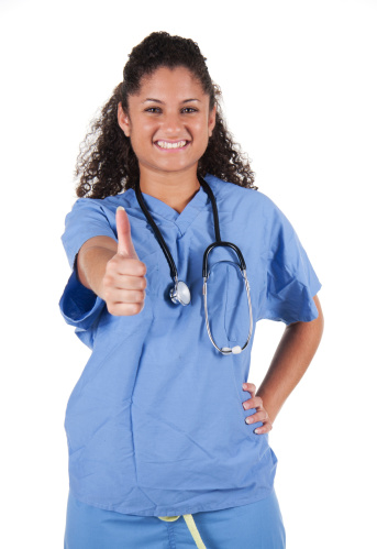 Latina Nurse Smiles in scrubs with stethoscope and thumbs up - ps how do you say cute in Spanish