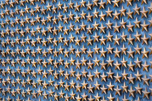 The Wall of Stars at the World War II Memorial in Washington DC, USA. Peace comes with price, lives sacrificed through out the history to bring freedom and liberty to the world. Each star represents approximately 100 service members. Forever they will be remembered and honored.