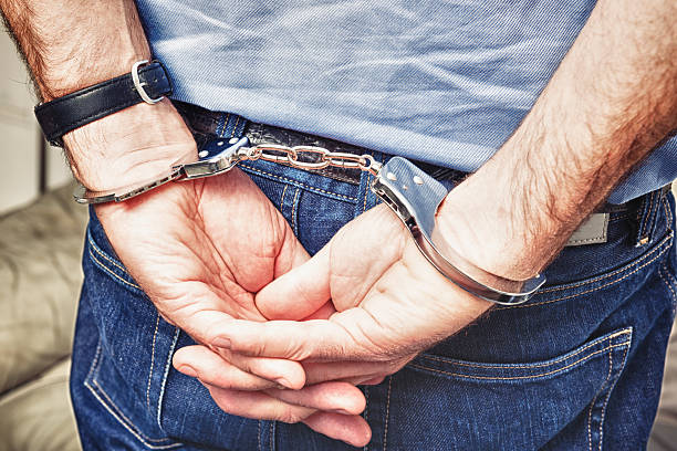 istock Man handcuffed - social issue woth legal system 175180610